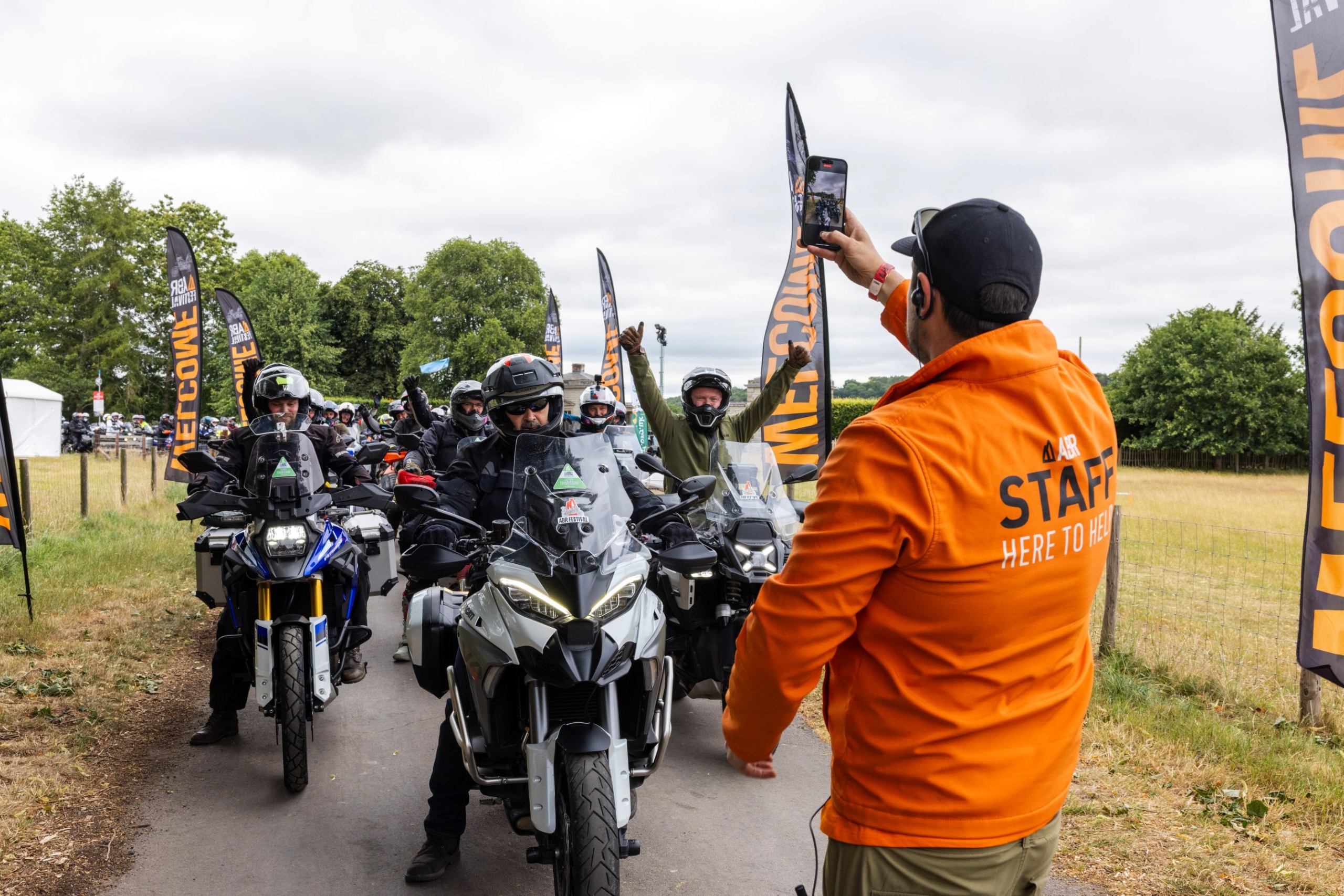 Biker riders next to Organisation Staff